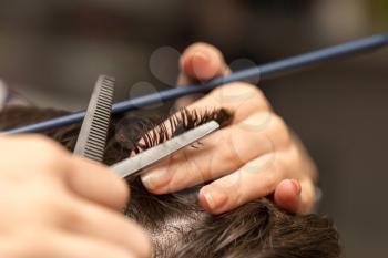 men's hair cutting scissors in a beauty salon