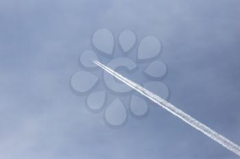 trace of an airplane against blue sky
