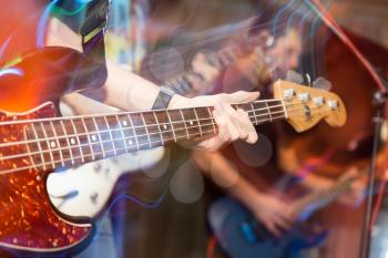 aggressive play guitar on stage