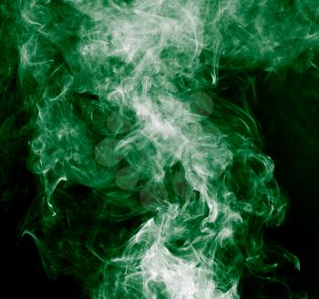 green smoke on a black background
