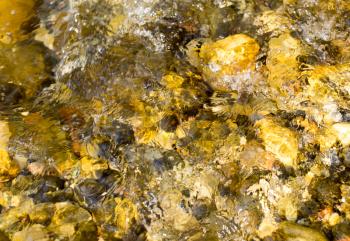 colored stones under water as background