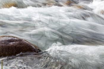 rough water in the mountain river water as a background