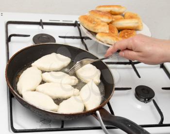 Food patties in a frying pan