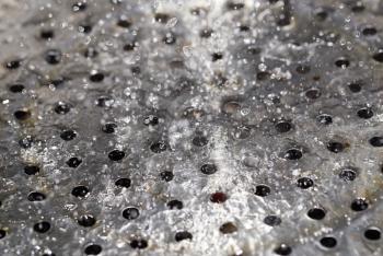 chromed metal in water drops