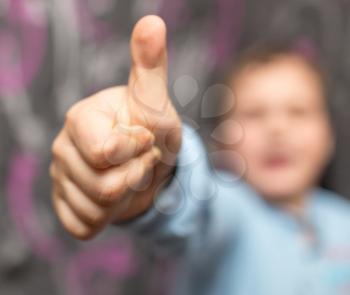 boy showing hand sign finger