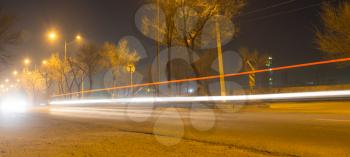 road at night with moving cars
