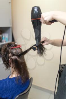 blow-drying in a beauty salon