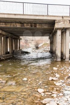 old concrete bridge on the river Sairam-su. Kazakhstan