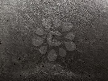 water on black leather