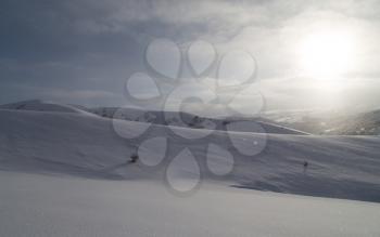 dawn sun in the snowy mountains of Kazakhstan