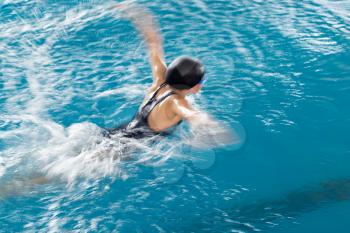 Girl swimming in the pool