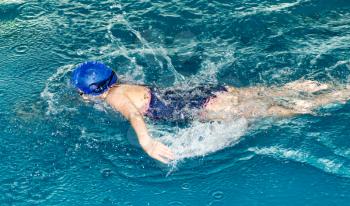 Girl swimming in the pool