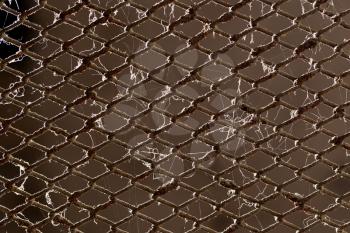 old rusty metal grid as a background