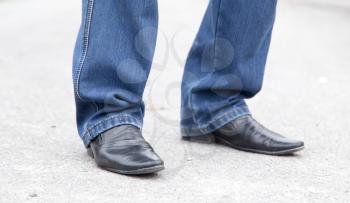 male legs in jeans and shoes