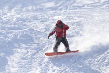 people snowboarding on the snow