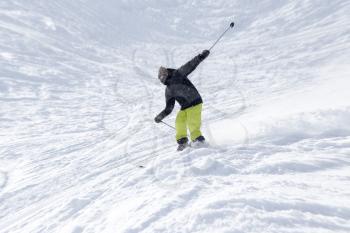 Athlete skiing in the snowy mountains