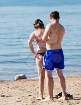 girl and man on beach
