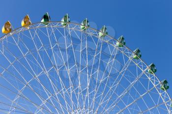 Ferris wheel against the blue sky