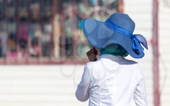 big blue hat on a woman