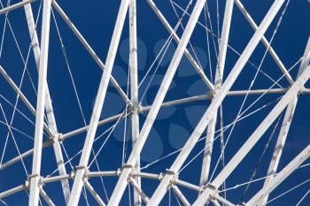 metal Ferris wheel against the blue sky