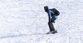 people skiing in the snow in the winter