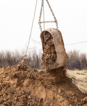 excavator digging a big bucket