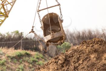 excavator digging a big bucket