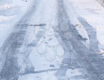 trace of wheel cars in the winter morning