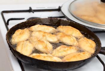 patties are fried in a pan