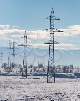 electric pole in nature in winter