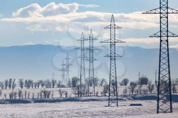 electric pole in nature in winter