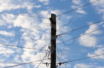 silhouette power pole against the sky