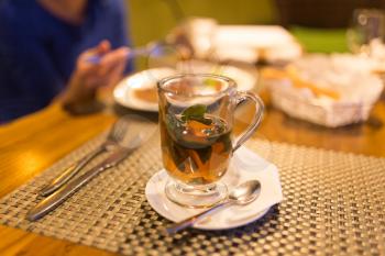 A glass of mint tea in a restaurant .