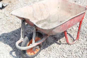 A cement wheelbarrow at the construction site