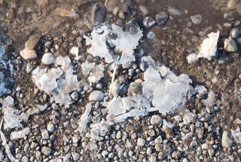 winter ice on the ground as a background .