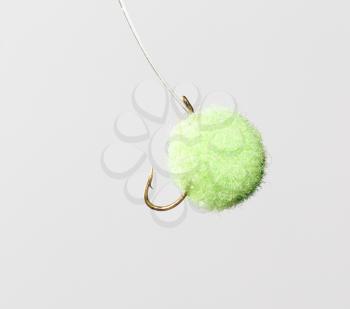 fly for fishing on a white background .