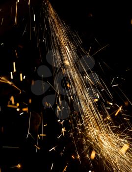 Sparks from metal on construction site as background .