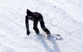 Snowboarder snowboarding in the snow in winter .