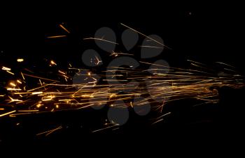 Sparks from metal on construction site as background .