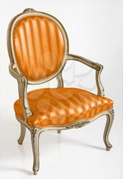 Orange armchair in style baroque