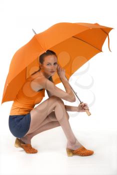 Beauty girl with orange umbrella, close up