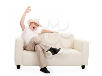 Royalty Free Photo of a Boy Sitting on a Couch