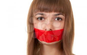 Royalty Free Photo of a Girl With Her Mouth Sealed