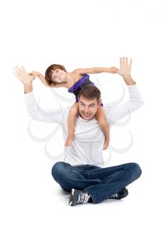Cheerful daughter on the neck with his father in the studio on a white background