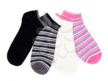 Four colored striped socks isolated on white background