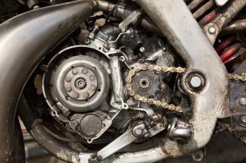 dirty motorcycle engine in the oily lubricant