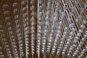 abstract strings and crystals arranged in geometric pattern