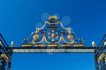 Detail of the gate against the blue sky. Summer Garden, St. Petersburg, Russia