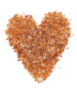 stacked heart of brown sugar. Isolated on white background