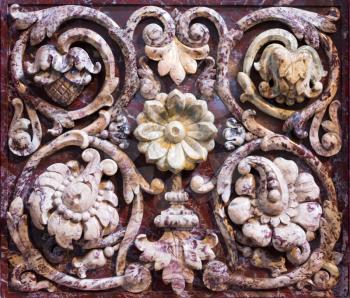 Marble bas-relief with floral motif, background
